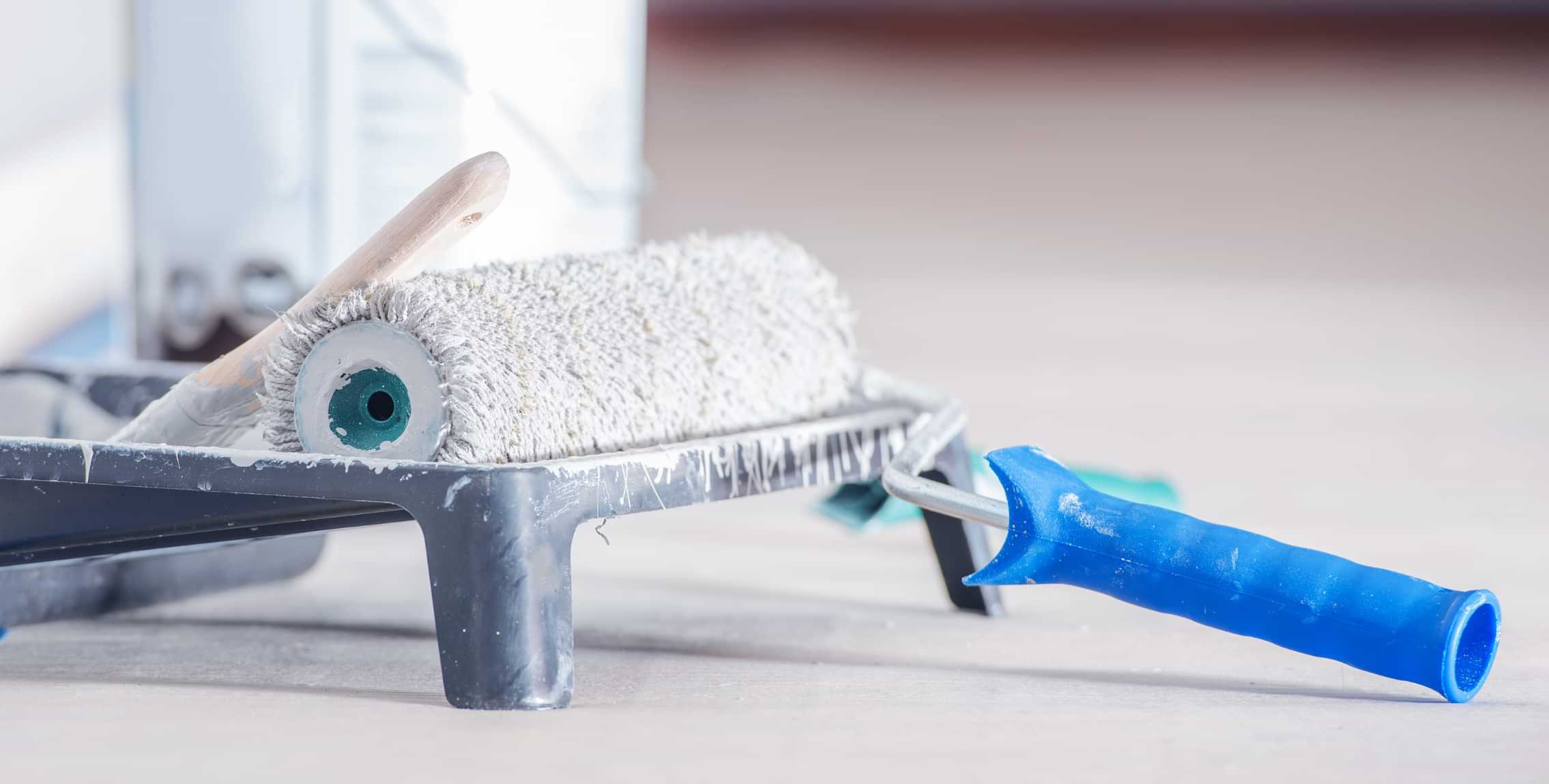 Paint roller and tray prepared for interior painting services