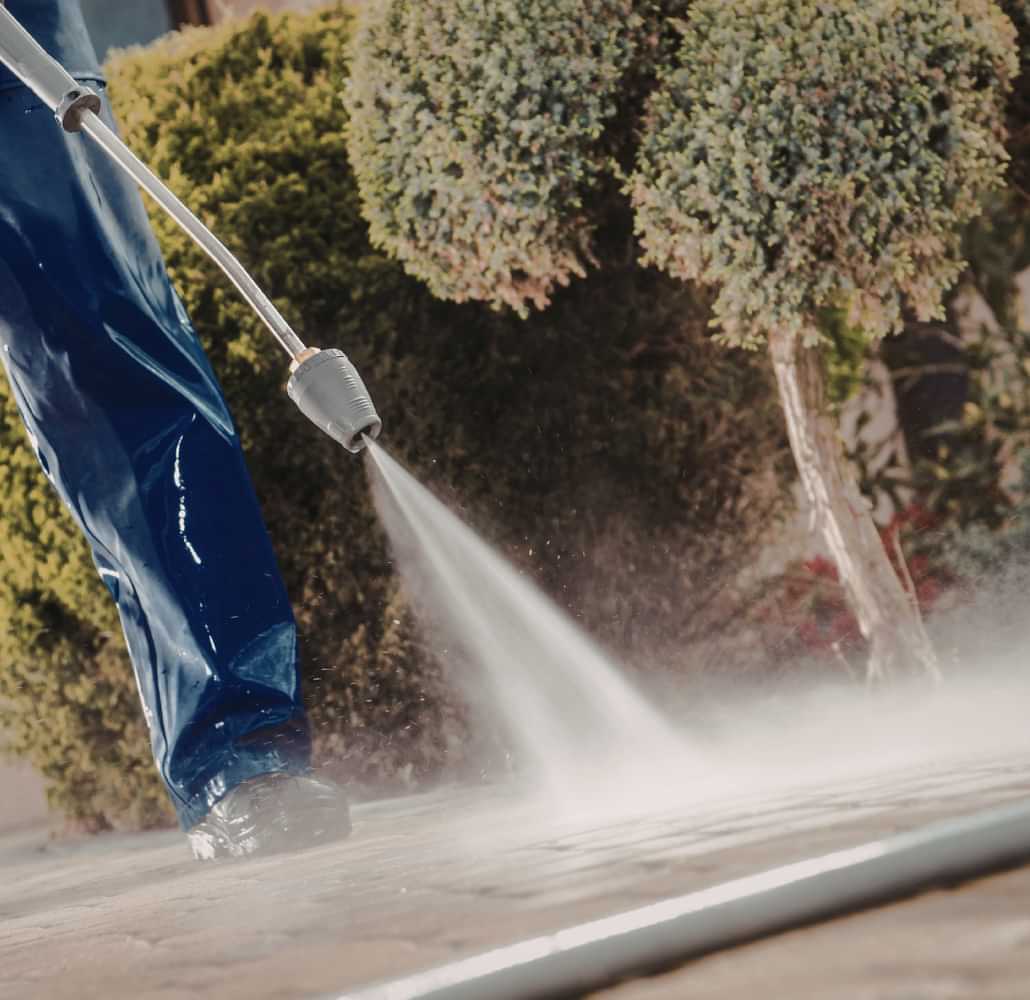 Pressure washing an outdoor patio surface