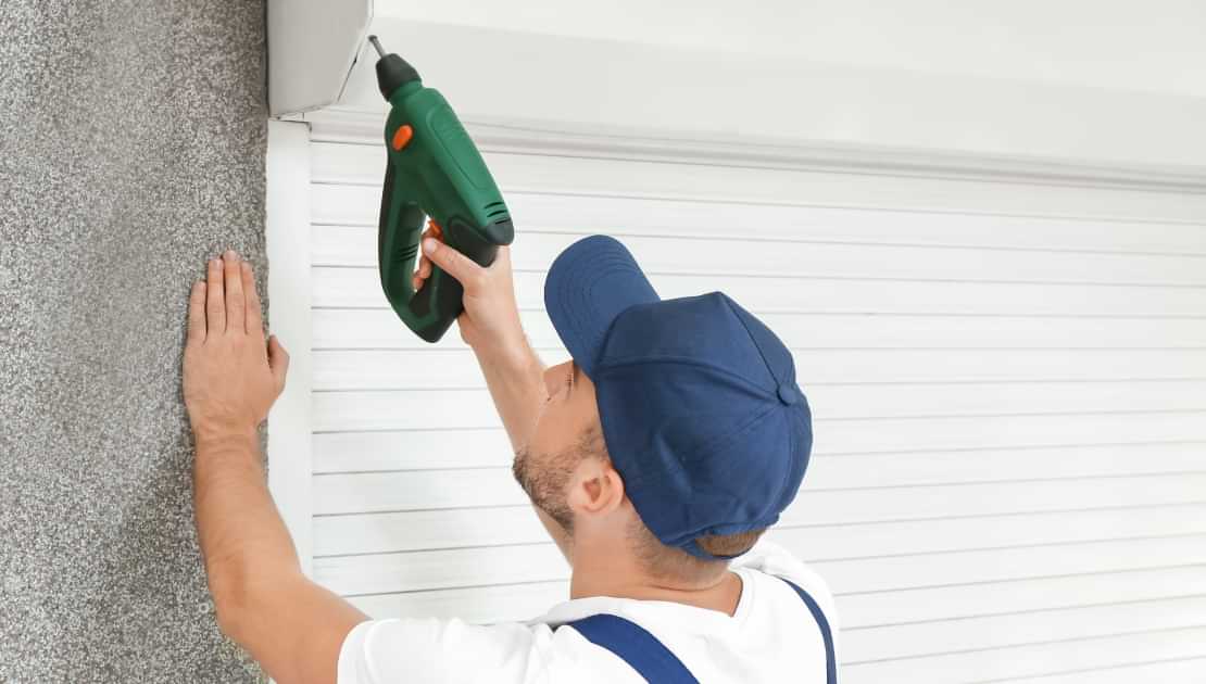 Installing a roller blind or screen above a window with a power drill